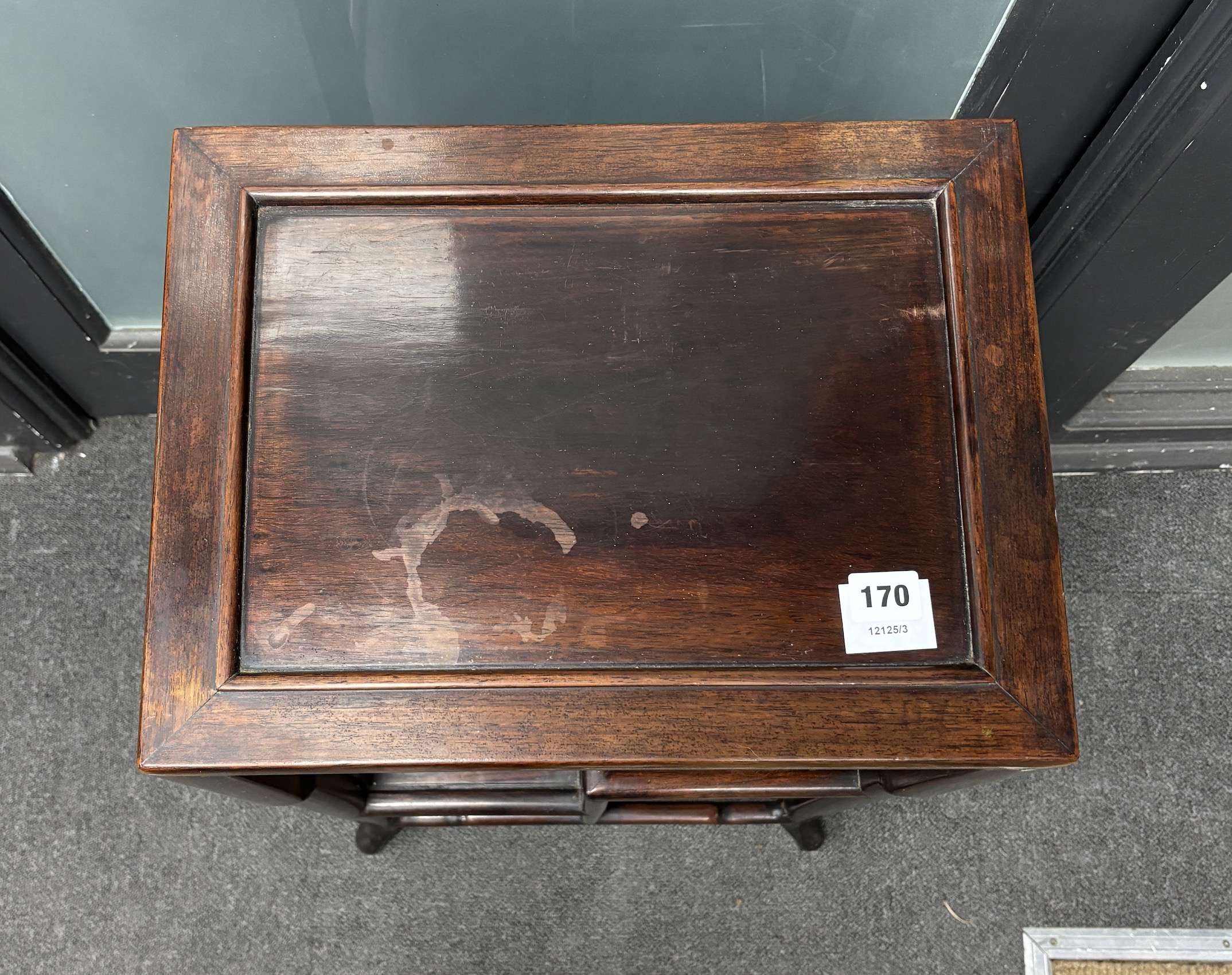 A Chinese hardwood three tier table, width 41cm, depth 31cm, height 74cm